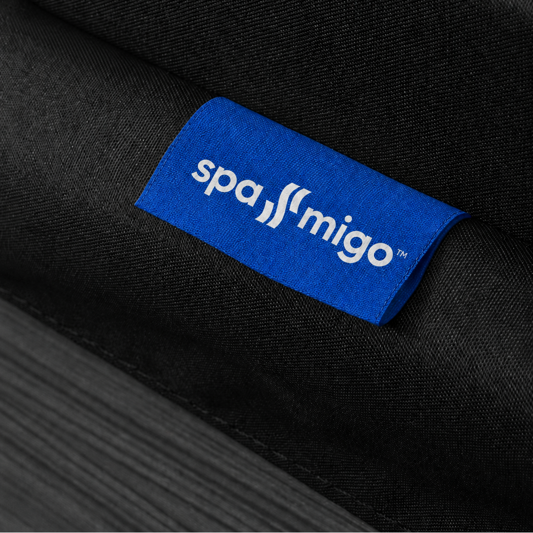 Black fabric with a blue 'spa-migo' logo tag