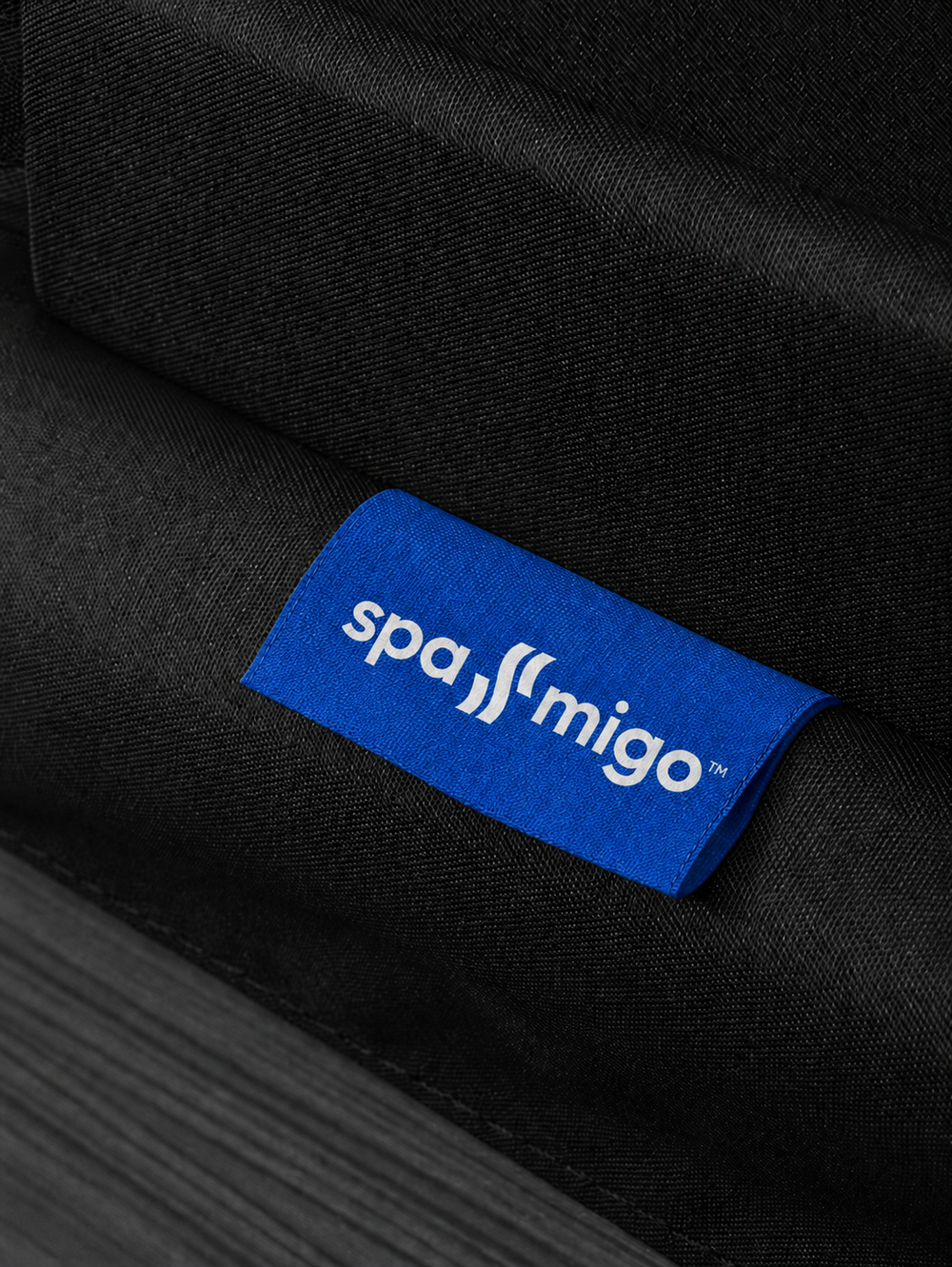 The woven Spa-Migo label on a finished cover