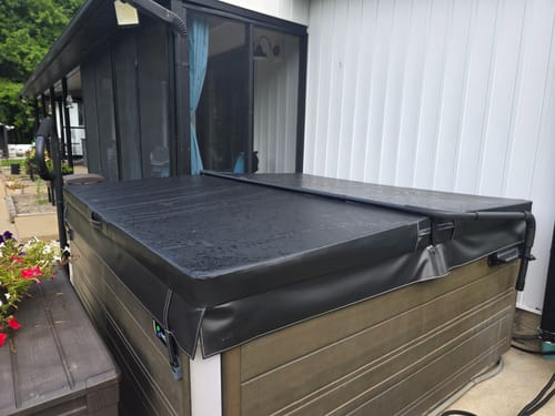 Customer photo of their new black custom hot tub cover