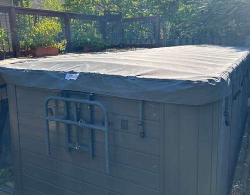 Customer photo review of a Rollaway swim spa cover rolled open