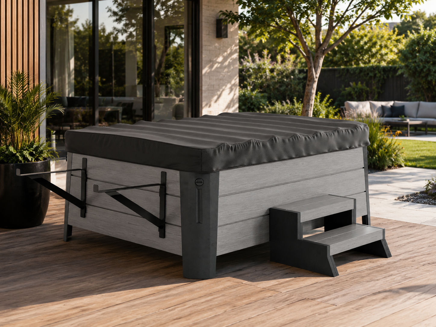 Outdoor rolling hot tub cover on a hot tub with steps on a wooden deck, surrounded by a garden.